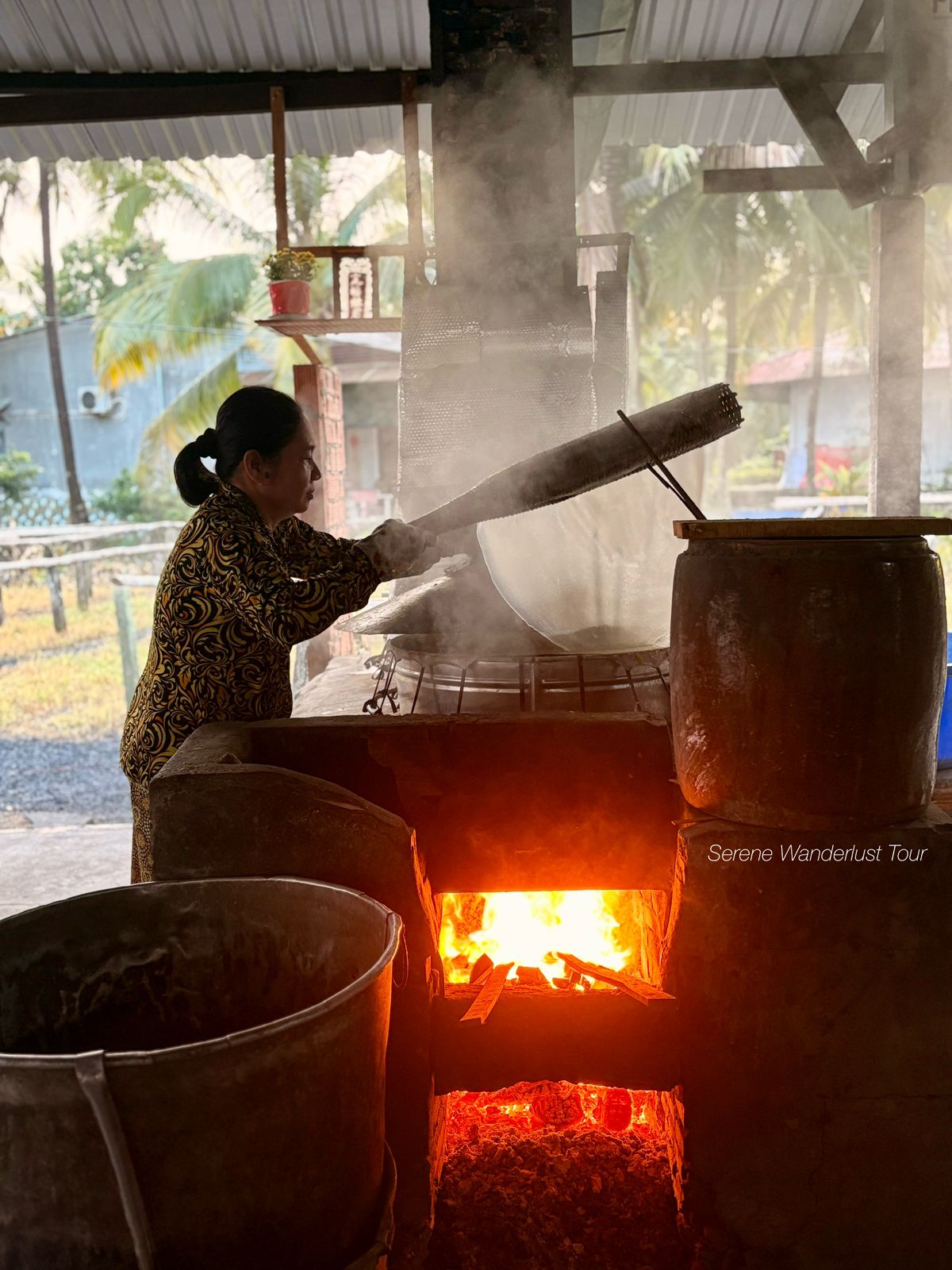 Traditional Vietnamese rice paper making using a wood-fired stove in Can Tho.